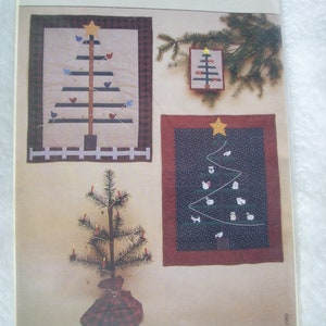 May include: A vintage pattern for a Christmas tree quilt with three different designs. The pattern is titled "O' Feather Tree" and includes the text "#153 Wild Goose Chase." The pattern is from O' Feather Tree, Box 1166, Grand Rapids, MI 49501.