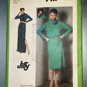 May include: A Simplicity 9111 sewing pattern envelope for a miss size 16 dress. The cover features illustrations and photographs of a long-sleeved dress with a cowl neckline and a tie waist. The text includes Jiffy, Time-Saver, and stretch knits.