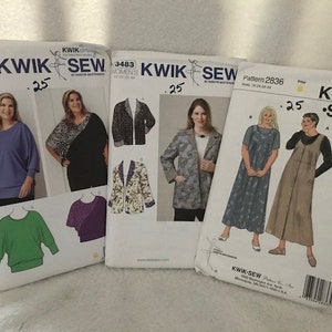 May include: Three sewing patterns for women's clothing. The patterns are for a long-sleeved top, a jacket, and a dress. The patterns are from Kwik Sew and have the numbers 3752, 3483, and 2836.
