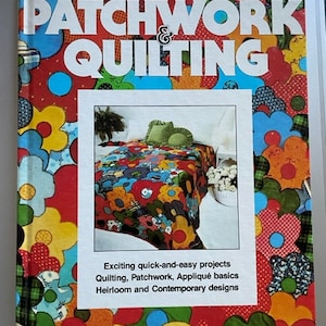 May include: A book titled "Patchwork & Quilting" by Better Homes and Gardens. The cover features a colorful patchwork quilt with floral designs and the text "Exciting quick-and-easy projects, Quilting, Patchwork, Appliqué basics, Heirloom and Contemporary designs."