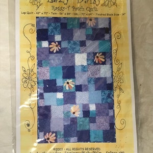 May include: A quilting pattern for a "Raggy-1 Patch Quilt" called "Lazy Daisy" with a blue and purple patchwork design with flower accents. The pattern includes instructions for making a lap quilt, twin quilt, and double quilt. The finished block size is 14 inches.