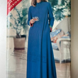 May include: A sewing pattern envelope for a floor-length blue robe with long sleeves, a high neckline, and a front zipper closure. The sleeve cuffs feature red and green trim. The text on the package reads See & Sew 3410, SIZE B (14-16-18).