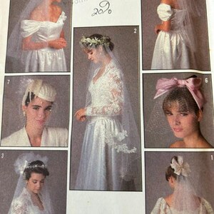 May include: A collection of bridal headpieces and veils featuring various styles including a floral crown, a large pink bow with netting, and several white tulle veils paired with lace and satin wedding dresses in a vintage pattern catalog.