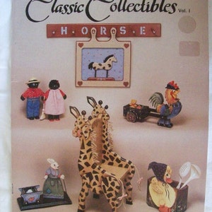 May include: A book titled "Classic Collectibles Vol. I" featuring painted wooden figurines of a horse, giraffe, rooster, bunny, and duck. The book includes instructions for painting these figurines.