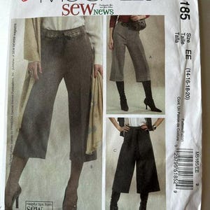May include: A McCall's M5185 sewing pattern envelope featuring illustrations of three variations of cropped trousers with tie-waist details. The white paper packaging displays the brand name, pattern number, size range EE (14-16-18-20), and a barcode.