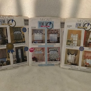 May include: Three McCall's Home Dec Ideas pattern books with various window treatment designs. Each book features a different color scheme and style of curtains, valances, and swags.