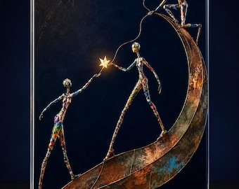 May include: A rectangular glass sculpture featuring three slender, multi-colored figures with mosaic-like patterns. Two figures stand on a large, curved, copper-toned crescent shape, while one figure kneels at the top, holding a string of glowing stars.