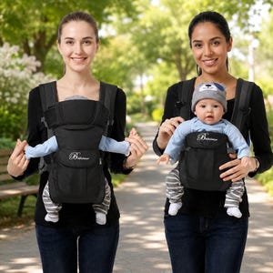 May include: A black baby carrier with adjustable straps and a front-facing seat, featuring the brand name Bethbear embroidered in white script on the front pocket. The carrier is designed for infants, providing support for the back and legs while in use.