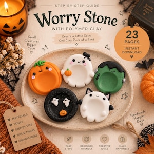 May include: A digital guide titled Step by Step Guide Worry Stone with Polymer Clay featuring 23 pages. The image displays five round, colorful polymer clay worry stones on a speckled plate, shaped like a pumpkin, ghost, monster, and cat.