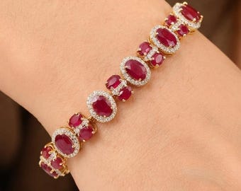 Bracciale tennis ovale con rubino e diamanti, in oro giallo 14 carati, gioiello pregiato, ideale come regalo.