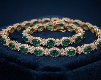 Bracciale tennis in oro giallo 14 carati con smeraldi e diamanti, lunghezza 7 pollici, con pietre preziose a taglio ovale.
