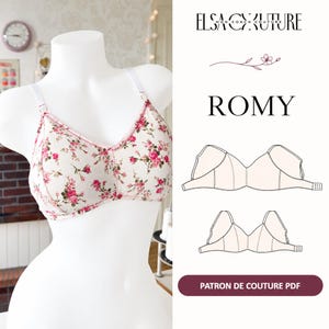 May include: A white bra with a pink and green floral print on a mannequin. The text Elsa Couture, Romy, and Patron de Couture PDF appears on the right side, along with two line drawings of the bra design and a small floral graphic illustration.