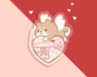 May include: A sticker featuring a cartoon Shiba Inu with angel wings, holding a pink heart filled with pink flowers and hearts. The sticker has a white outline and the text "THOUSANDWISHES" is visible at the bottom.