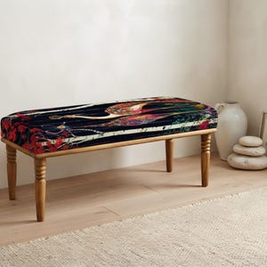 May include: A rectangular bench with four turned wooden legs and a cushioned seat featuring a dark background with a colorful, intricate bird illustration in shades of red, orange, yellow, and blue, accented by white tree branch patterns.