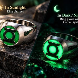 May include: A silver-toned metal ring featuring a circular face with a green Lantern symbol. The text In Sunlight Ring charges and In Dark / Night Ring glows with Green Light appears alongside the ring in two different lighting states.