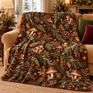 May include: A brown throw blanket featuring a repeating pattern of pinecones, evergreen branches, red berries, oak leaves, and mushrooms. The design includes small gold star accents scattered across the dark brown fabric surface.