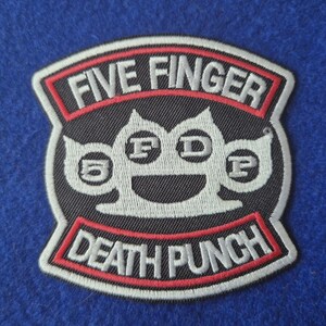 May include: A black, white, and red embroidered patch featuring the text FIVE FINGER DEATH PUNCH. The centre design depicts a stylised white brass knuckle graphic with the letters F, D, and P and the number 5 integrated into the shape.