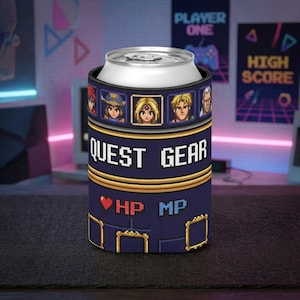 May include: A dark blue can cooler featuring pixel art graphics. The design includes a row of five character portraits, the text QUEST GEAR in white pixelated font, a red heart icon, and the labels HP and MP in a retro video game style.
