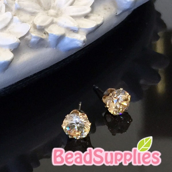 FN-ER-02063 - Gold plated, 6mm Rhinestone stud earring,  champagne, 2 pairs (with ear nuts)