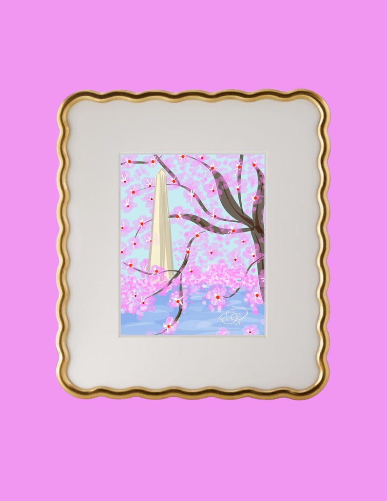 May include: A framed illustration of a white obelisk with a pink cherry blossom tree in the foreground. The background is a light blue sky with white clouds. The frame is gold with a scalloped edge.