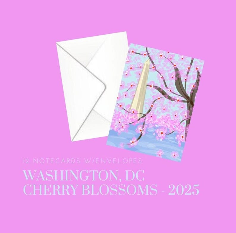 May include: A set of 12 notecards with envelopes featuring a watercolour illustration of the Washington Monument with cherry blossoms in bloom. The text "WASHINGTON, DC CHERRY BLOSSOMS - 2025" is printed below the image.
