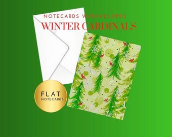 May include: Flat notecards with envelopes. The notecard features a green background with a pattern of green Christmas trees and red cardinals. The text "WINTER CARDINALS" is displayed in red.