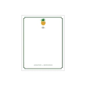 May include: A white notepad with a green border and a pineapple illustration. The notepad has the initials "J.B.L." and the name "JENNIFER L. BORKOWSKI" printed on it.