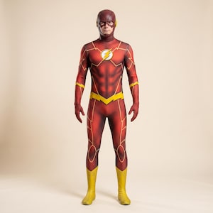 May include: A full-body red superhero costume featuring a textured honeycomb pattern, yellow lightning bolt accents on the arms and waist, and a circular chest emblem with a yellow lightning bolt. The suit includes a matching red headpiece.
