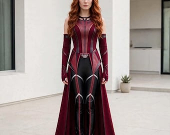 May include: A Scarlet Witch costume featuring a deep red bodice with a high neckline, long matching arm sleeves, and a floor-length open skirt. The outfit includes black leggings with red and silver vertical accents and a pointed red headpiece.