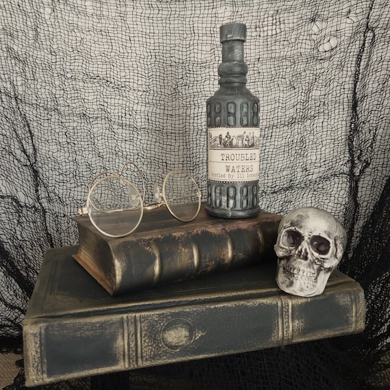 spooky creepy Halloween book display decor apothecary Haunted house prop, specimin skull display, human skull, spell books, shelf decor