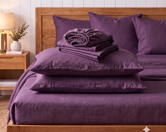 May include: A dark purple bedding set featuring a flat sheet, a fitted sheet, and two pillowcases. The linens are arranged neatly on a wooden bed frame. The text "DARK PURPLE" is visible in the upper left corner of the image.