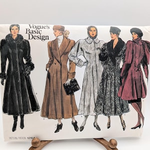 May include: A Vogue's Basic Design sewing pattern envelope, number 1764, featuring illustrations of five different long coats. The designs include various collar styles, sleeve lengths, and textures, displayed on a white background with black text.