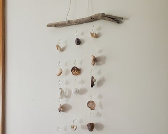 Suncatcher 15 crystals, 14 round, 1 teardrop chandelier crystal, 3 strands, some barnacle shells, old, odd, the sun sparkle through window