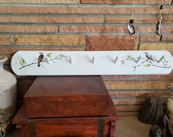 Coat rack 36 inches long with 7 pegs with rounded corners. This transfer has a few birds on branches.