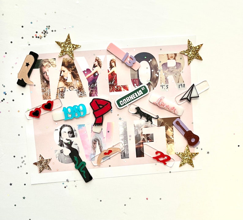 May include: A collage of colorful acrylic stickers featuring the name "TAYLOR SWIFT" with various album titles and song lyrics, including "1989", "Cornelia Street", "Lover", and "T.S. 1989".