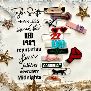 May include: A collage of album covers and other graphics representing Taylor Swift's music career. The album titles include "Fearless", "Speak Now", "Red", "1989", "reputation", "Lover", "folklore", "evermore", and "Midnights".