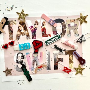May include: A collection of colorful acrylic cutouts featuring the word "TAYLOR SWIFT" with various album titles and song lyrics, including "1989", "Cornelia Street", "Lover", and "Fearless".