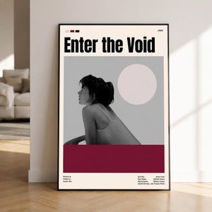 May include: A framed film poster for Enter the Void, featuring a black and white profile of a person, a pale pink circle, and a deep red block. The text includes the title, the year 2009, and a list of cast and crew members in black font.