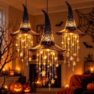 May include: Three black witch hat pendant lights featuring a textured, lace-like fabric finish and a decorative buckle. Each hat is illuminated from within and adorned with cascading strings of glowing star-shaped ornaments and clear crystals.