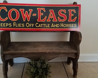 Vintage Style Metal Sign COW EASE Keeps Flies Off Cattle and Horses 29 x9