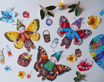May include: Three colorful butterfly fairies with painted faces and wings. Each fairy is wearing a different outfit and has a different colored butterfly wing. The fairies are surrounded by flowers, berries, and other nature-themed elements.