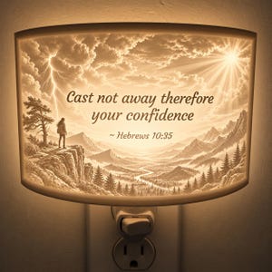 May include: A rectangular plug-in night light featuring a sepia-toned landscape illustration of a person standing on a cliff overlooking a valley with mountains, a river, and a lightning bolt. The text reads: Cast not away therefore your confidence ~ Hebrews 10:35.