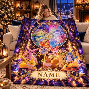 May include: A rectangular fleece blanket featuring a vibrant stained-glass circular design of various Eevee evolution characters. Below the circular motif, a decorative golden banner displays the word NAME in bold, capitalized letters.
