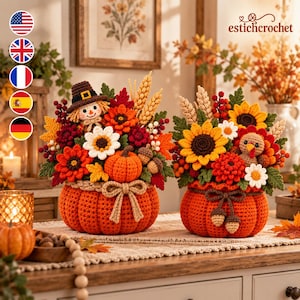 May include: Two crocheted pumpkin-shaped containers filled with autumn-themed floral arrangements. One features a scarecrow, the other a turkey, surrounded by sunflowers, wheat stalks, red berries, and leaves in orange, yellow, and brown tones.
