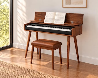 May include: A dark wood digital piano with a black keyboard and a matching bench. The piano features a hinged lid that acts as a music stand, currently holding an open book of sheet music. The instrument stands on four tapered wooden legs.