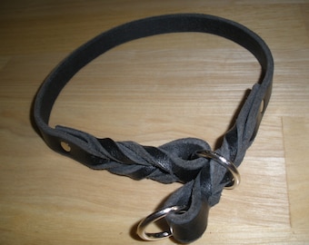 May include: Black leather dog collar with a braided design and two silver D-rings.