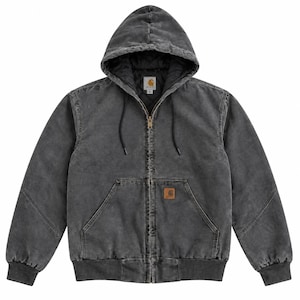 May include: A charcoal grey hooded jacket with a full-length front zip, long sleeves, and ribbed cuffs. The garment features a quilted interior lining, a drawstring hood, and two front pockets with a rectangular Carhartt brand patch.