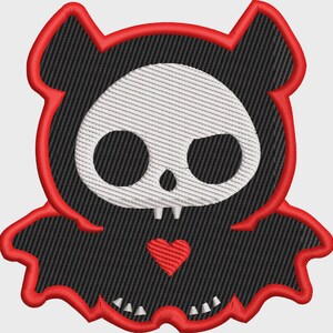 May include: An embroidered patch featuring a stylised black ghost figure with a white skull face, two small white teeth, and a red heart on its chest. The entire design is outlined with a thick, vibrant red border and has a textured thread finish.
