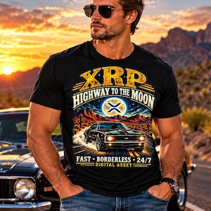 May include: A black t-shirt featuring a graphic print of a classic muscle car driving through a desert landscape at night. The text reads XRP HIGHWAY TO THE MOON, FAST BORDERLESS 24/7 DIGITAL ASSET, with a glowing moon and the XRP logo above the car.
