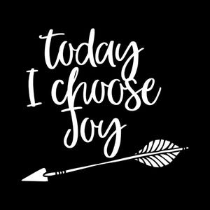 May include: A black graphic design featuring the white text "today I choose joy" in a stylised script font. Below the text is a white illustration of an arrow with a feathered fletching and a pointed tip, oriented horizontally across the frame.